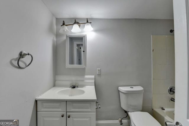 73 Atlanta Ave SW, Atlanta, GA 30315 - full bathroom featuring baseboards, toilet, vanity, and bathing tub / shower combination
