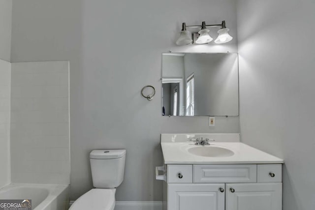 73 Atlanta Ave SW, Atlanta, GA 30315 - bathroom featuring baseboards, toilet, and vanity