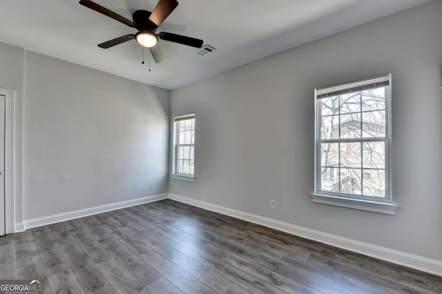 73 Atlanta Ave SW, Atlanta, GA 30315 - spare room featuring dark wood finished floors, baseboards, and visible vents
