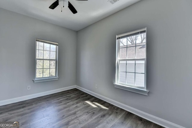 73 Atlanta Ave SW, Atlanta, GA 30315 - unfurnished room featuring baseboards, dark wood-style floors, ceiling fan, and visible vents
