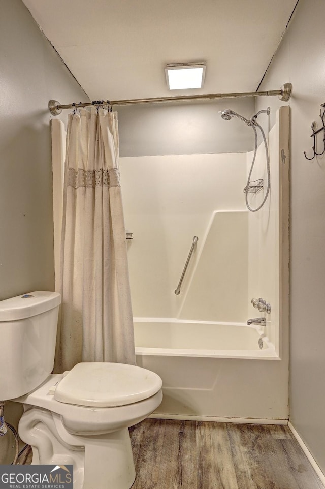 12 John Boy Trl, Newnan, GA 30263 - bathroom with toilet, shower / tub combo with curtain, and wood finished floors