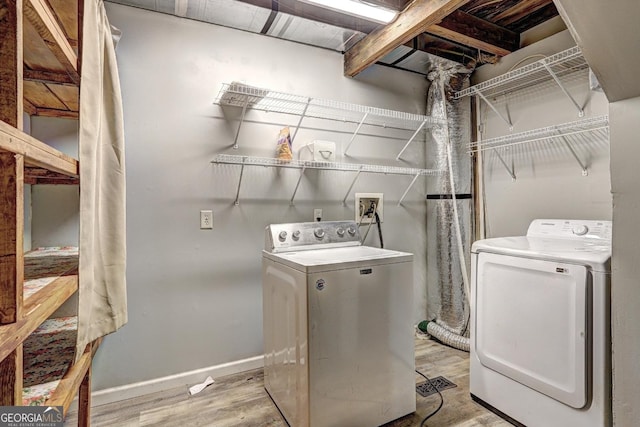 12 John Boy Trl, Newnan, GA 30263 - laundry room with washer and dryer, wood finished floors, and baseboards