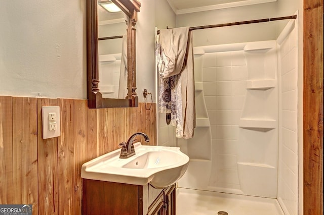12 John Boy Trl, Newnan, GA 30263 - full bathroom featuring a stall shower, vanity, wainscoting, wood walls, and ornamental molding