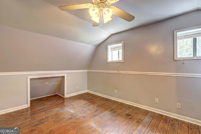 12 John Boy Trl, Newnan, GA 30263 - additional living space featuring vaulted ceiling, baseboards, a ceiling fan, and hardwood / wood-style flooring