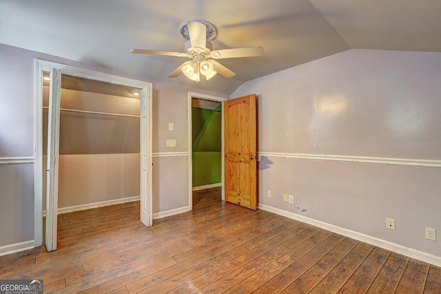 12 John Boy Trl, Newnan, GA 30263 - unfurnished bedroom with vaulted ceiling, wood finished floors, a closet, baseboards, and a ceiling fan