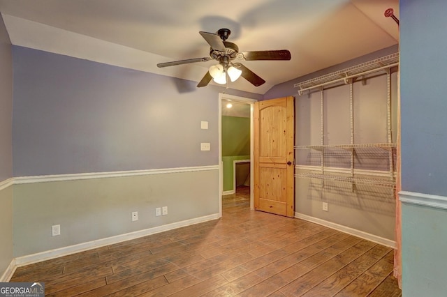 12 John Boy Trl, Newnan, GA 30263 - unfurnished bedroom with wood finished floors, baseboards, lofted ceiling, and a ceiling fan