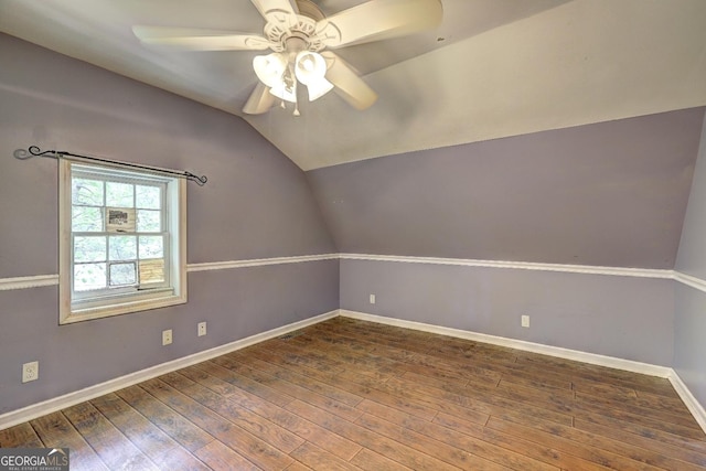 12 John Boy Trl, Newnan, GA 30263 - spare room with ceiling fan, hardwood / wood-style floors, vaulted ceiling, and baseboards