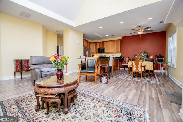 207 Meadow Lake Dr, Carrollton, GA 30116 - living area with light wood-style floors, recessed lighting, baseboards, a ceiling fan, and lofted ceiling