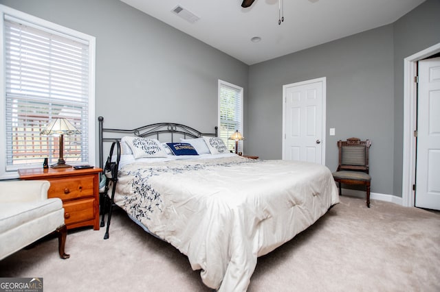 207 Meadow Lake Dr, Carrollton, GA 30116 - bedroom with light carpet, baseboards, and a ceiling fan