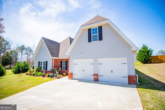 207 Meadow Lake Dr, Carrollton, GA 30116 - traditional-style house with brick siding, an attached garage, a front yard, and driveway