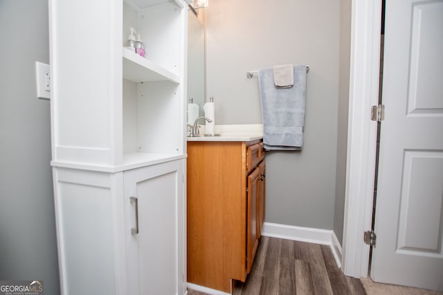207 Meadow Lake Dr, Carrollton, GA 30116 - bathroom featuring wood finished floors, vanity, and baseboards