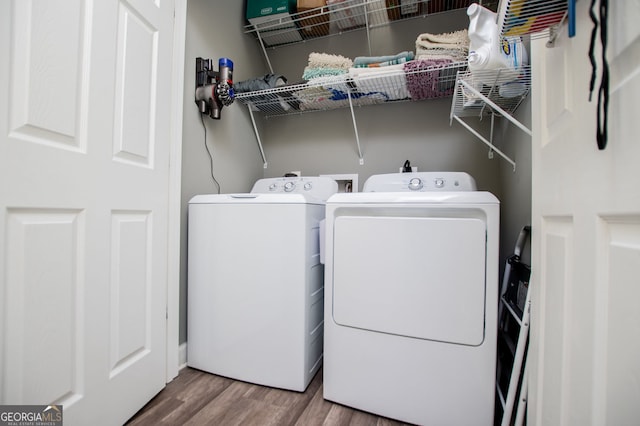 207 Meadow Lake Dr, Carrollton, GA 30116 - laundry area featuring separate washer and dryer and wood finished floors