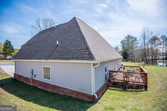 207 Meadow Lake Dr, Carrollton, GA 30116 - view of side of property with roof with shingles, a wooden deck, and a lawn
