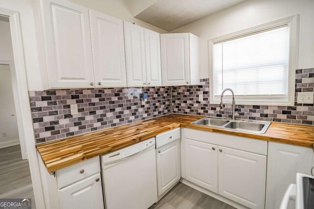 107 Griffith St, Winder, GA 30680 - kitchen featuring a sink, white cabinetry, butcher block counters, and dishwasher
