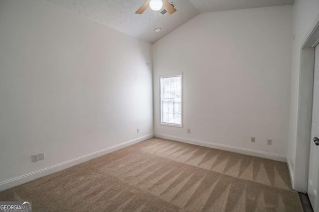 107 Griffith St, Winder, GA 30680 - empty room featuring light colored carpet, a ceiling fan, baseboards, and high vaulted ceiling