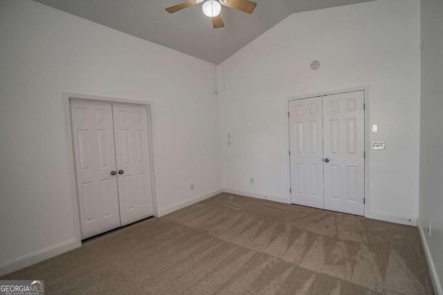 107 Griffith St, Winder, GA 30680 - unfurnished bedroom with baseboards, carpet, a ceiling fan, and high vaulted ceiling