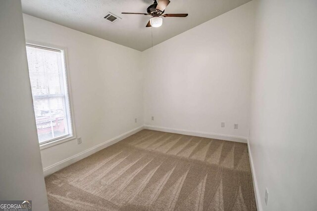 107 Griffith St, Winder, GA 30680 - empty room with baseboards, ceiling fan, carpet flooring, and visible vents