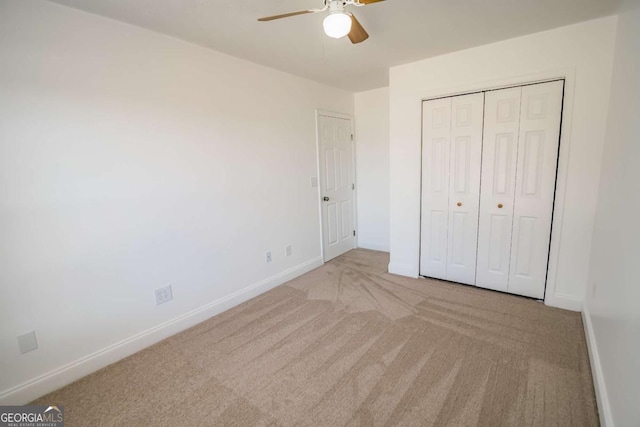 107 Griffith St, Winder, GA 30680 - unfurnished bedroom with carpet flooring, a ceiling fan, baseboards, and a closet