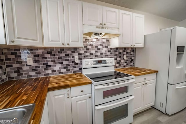 107 Griffith St, Winder, GA 30680 - kitchen featuring white appliances, under cabinet range hood, white cabinets, and butcher block countertops