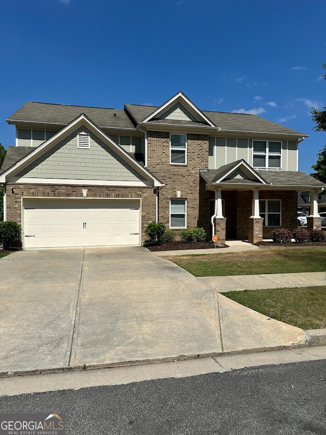 2470 Wevok Way, Grayson, GA 30017 - view of front of home featuring an attached garage, driveway, and brick siding