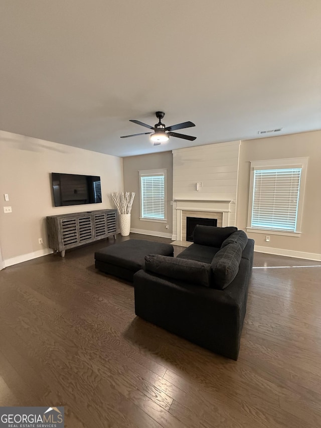 2470 Wevok Way, Grayson, GA 30017 - living room with baseboards, dark wood-style flooring, ceiling fan, and a wealth of natural light