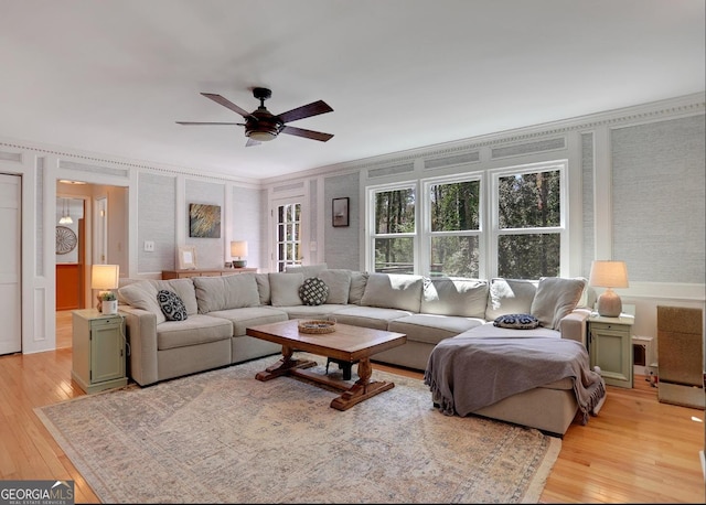 1135 Parkview Way, Lilburn, GA 30047 - living room with light wood finished floors, ceiling fan, and a healthy amount of sunlight
