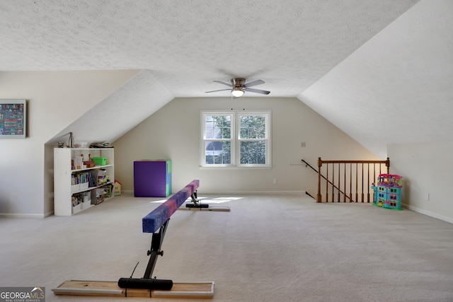 1135 Parkview Way, Lilburn, GA 30047 - workout area featuring a ceiling fan, carpet flooring, vaulted ceiling, and baseboards