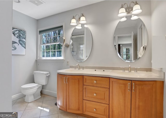 1135 Parkview Way, Lilburn, GA 30047 - full bathroom featuring toilet, tile patterned flooring, double vanity, and a sink