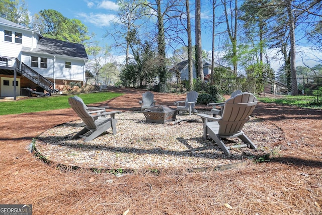 1135 Parkview Way, Lilburn, GA 30047 - view of yard with fence, a fire pit, and stairway