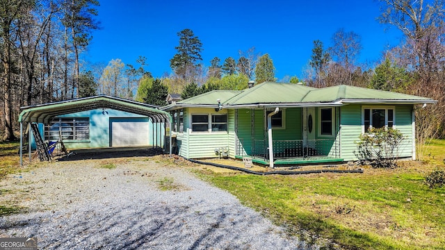 438 Wilkerson Rd SW, Rome, GA 30165 - view of front facade featuring a porch, driveway, and metal roof