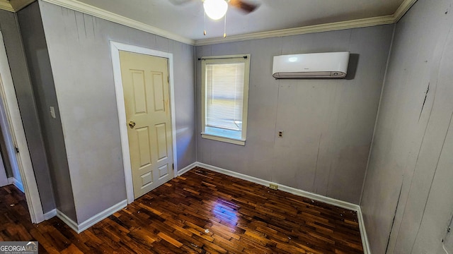 438 Wilkerson Rd SW, Rome, GA 30165 - unfurnished bedroom featuring dark wood-style floors, a wall mounted air conditioner, baseboards, ornamental molding, and ceiling fan