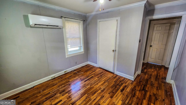 438 Wilkerson Rd SW, Rome, GA 30165 - unfurnished bedroom featuring a wall mounted air conditioner, ornamental molding, wood finished floors, and baseboards