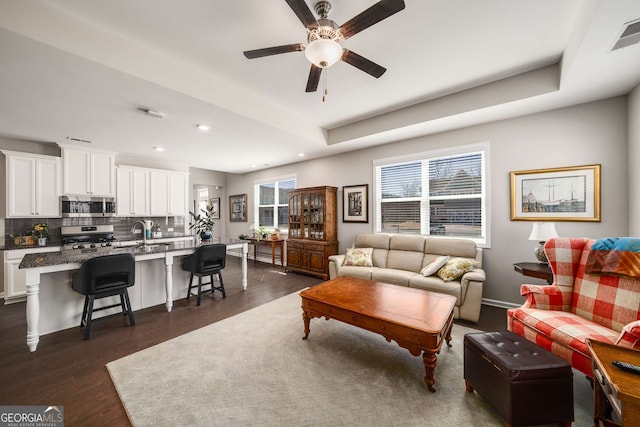 2910 Bishopstone Way, Cumming, GA 30040 - living room featuring visible vents, baseboards, ceiling fan, dark wood-style floors, and recessed lighting