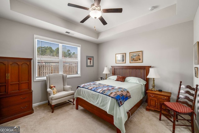 2910 Bishopstone Way, Cumming, GA 30040 - bedroom with baseboards, visible vents, a raised ceiling, light colored carpet, and ceiling fan