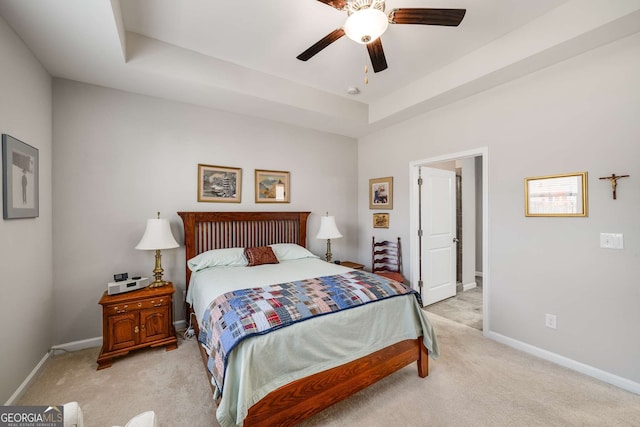 2910 Bishopstone Way, Cumming, GA 30040 - bedroom featuring a raised ceiling, light carpet, ceiling fan, and baseboards