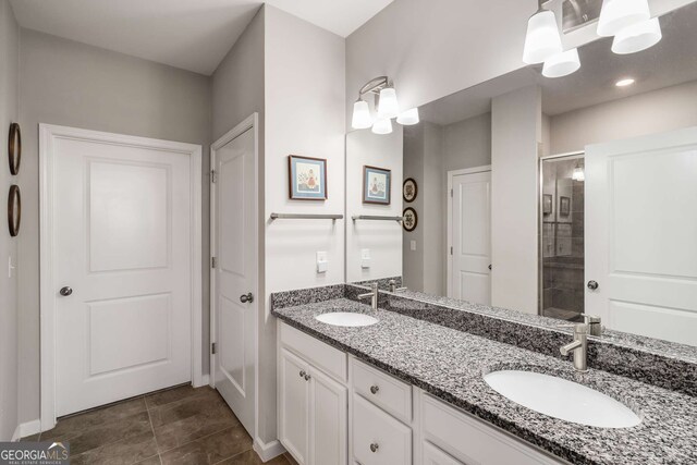 2910 Bishopstone Way, Cumming, GA 30040 - full bathroom featuring a shower stall, double vanity, a sink, and baseboards