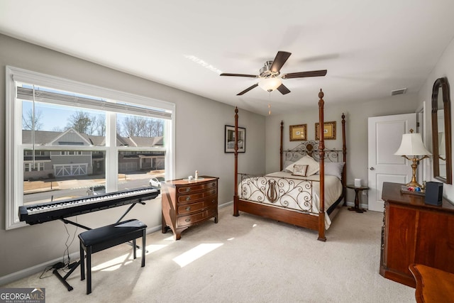 2910 Bishopstone Way, Cumming, GA 30040 - bedroom featuring light colored carpet, baseboards, a ceiling fan, and visible vents