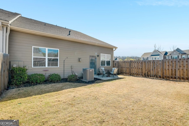 2910 Bishopstone Way, Cumming, GA 30040 - back of property with fence, cooling unit, a patio, and a lawn