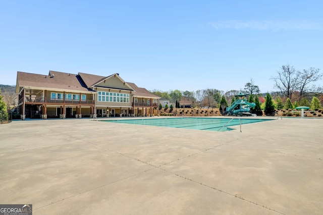 2910 Bishopstone Way, Cumming, GA 30040 - pool with a patio and a water slide