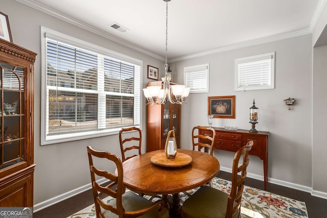2910 Bishopstone Way, Cumming, GA 30040 - dining room featuring dark wood-style flooring, a notable chandelier, baseboards, ornamental molding, and visible vents