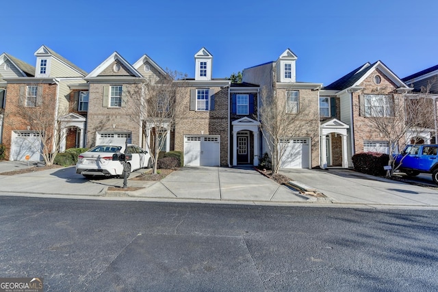 view of property with driveway and an attached garage