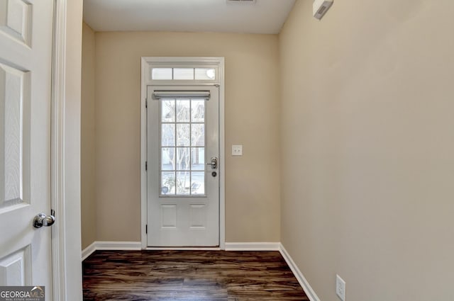 entryway with baseboards, dark wood-style floors, and visible vents