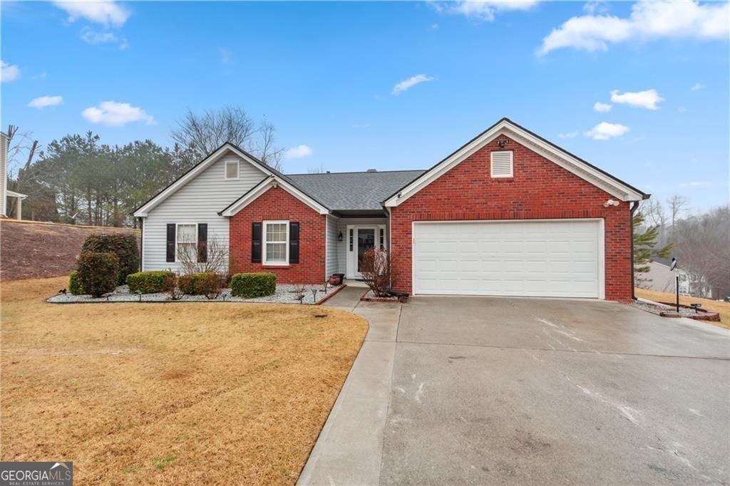 1760 Campbell Ives Dr, Lawrenceville, GA 30045 - single story home featuring brick siding, an attached garage, a front yard, and driveway