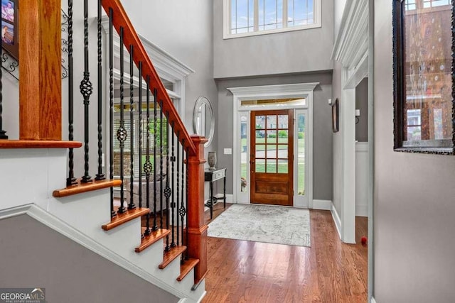 1521 Waterside Ct, Jefferson, GA 30549 - entryway featuring a high ceiling, plenty of natural light, wood finished floors, stairway, and baseboards