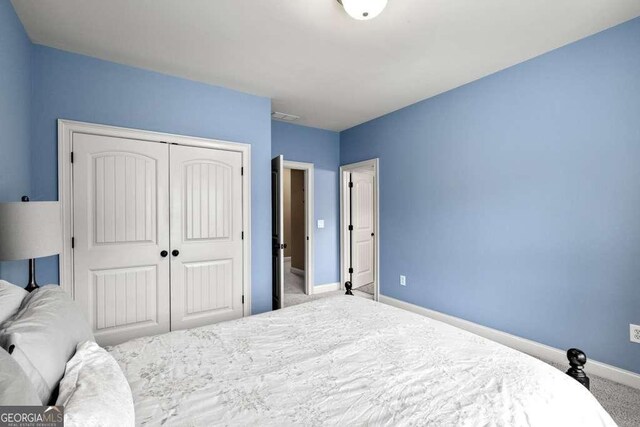 1521 Waterside Ct, Jefferson, GA 30549 - bedroom featuring carpet floors, a closet, and baseboards