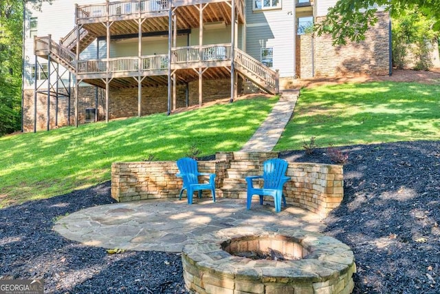 1521 Waterside Ct, Jefferson, GA 30549 - back of property featuring stairs, a fire pit, a deck, and a lawn