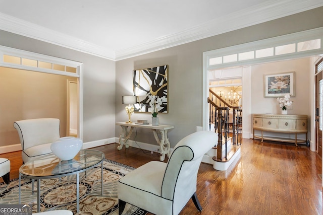 150 Inwood Ter, Roswell, GA 30075 - living area with wood finished floors, a notable chandelier, ornamental molding, and baseboards