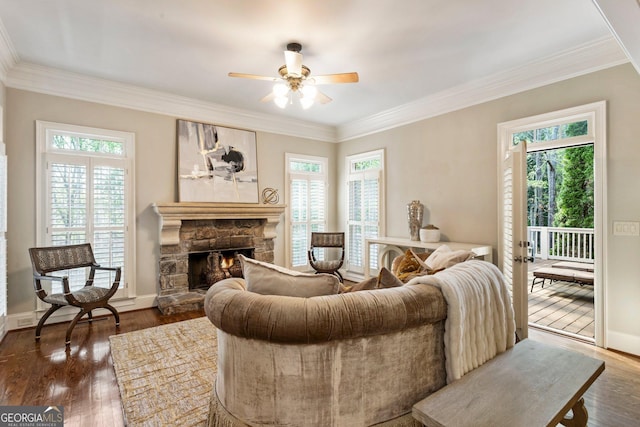 150 Inwood Ter, Roswell, GA 30075 - living room with a fireplace, dark wood-type flooring, baseboards, and ceiling fan