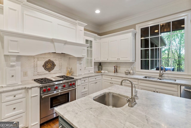 150 Inwood Ter, Roswell, GA 30075 - kitchen featuring backsplash, designer stove, a sink, and white cabinetry