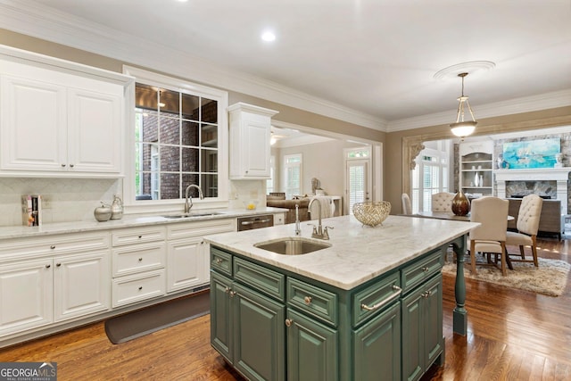 150 Inwood Ter, Roswell, GA 30075 - kitchen with white cabinets, a kitchen island with sink, green cabinets, and a sink